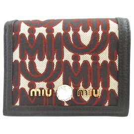 Cartera tri-fold de lona y cuero negro Miu Miu Negro
