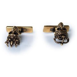 Alexander McQueen, gold toned skull cufflinks Golden