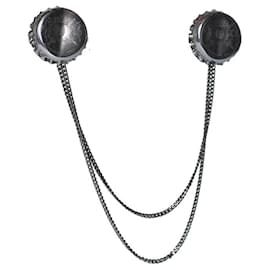 Alexander McQueen, bottle cap brooche in silvery Silvery