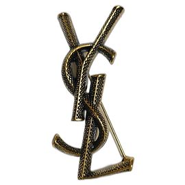 Yves Saint Laurent Cassandre motif serpent Doré