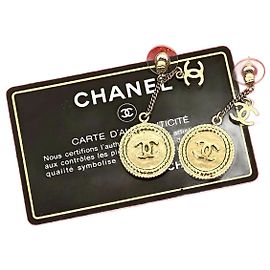 Brincos de moeda Coco Mark da Chanel Dourado Metálico
