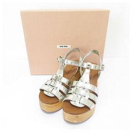 Sandali in pelle Miu Miu in legno Argento