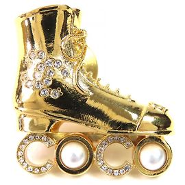 Chanel Coco Rollschuh Brosche Golden