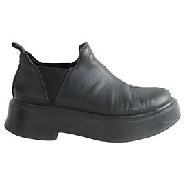 The row Mocasines de cuero negro Negro