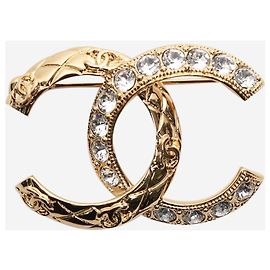 Chanel Broche de diamantes CC dorada Dorado