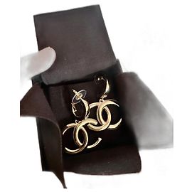 Boucles d'oreilles Chanel dorées en acier Doré