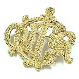 Broche de metal dourado Christian Dior Dourado