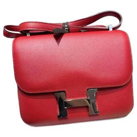 Sac Hermès Constance rouge en cuir Epsom. Rouge