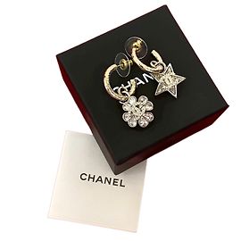 Chanel Coco Mark Sternblumenohrringe Silber Metallisch