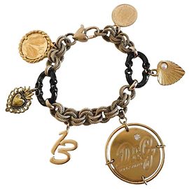 Prezioso bracciale vintage DOLCE & GABBANA nell'iconico modello "Token Money" oro e nero Nero D'oro
