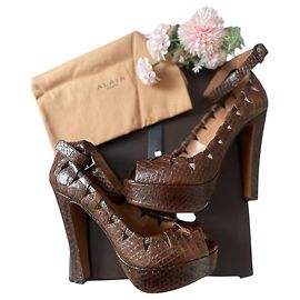 Sandali Alaïa in pelle di pitone marrone Marrone