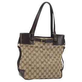 Bolsa bucket com cinto Gucci GG em lona com couro pequena Bege