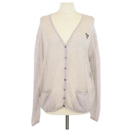 Cardigan em mistura de lã e seda bege da Prada com logo bordado em malha canelada Bege