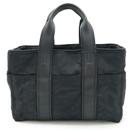 Bolsa tote Acapulco PM em nylon e couro da Hermès Preto