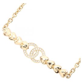 Collier en forme de cœur avec le logo Coco de Chanel Doré