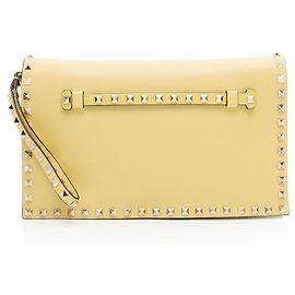 Valentino Garavani Clutch Rockstud de cuero Nappa Valentino Amarillo