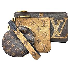 LOUIS VUITTON Pochette Trio Monogram Géant Inversé Marron Monogramme