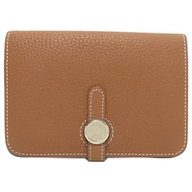 Monedero compacto Dogon de Hermès Dorado