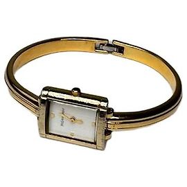 Montre à quartz plaquée or vintage Yves Saint Laurent Doré