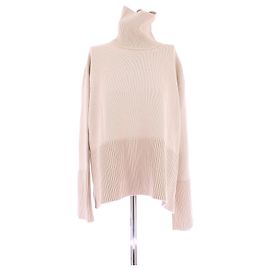 Totême Creme Rollkragenpullover Beige