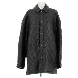 Balenciaga Abrigo de cuero acolchado Negro