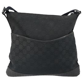 Sac messager à zip Gucci GG en toile avec cuir perforé moyen Noir