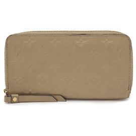 Portafoglio Zippy Monogram Empreinte Louis Vuitton Marrone Beige