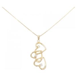 Autre Marque Collana Au750 con tre diamanti a forma di cuore D'oro