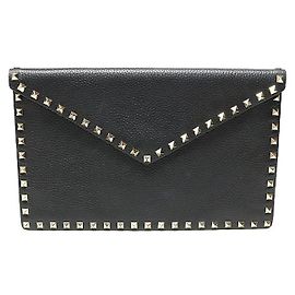 Valentino Clutch envelope em couro preto estampado com tachas douradas Rockstud Preto