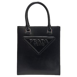 Prada Bolso cruzado mini de cuero con logo triangular negro Negro