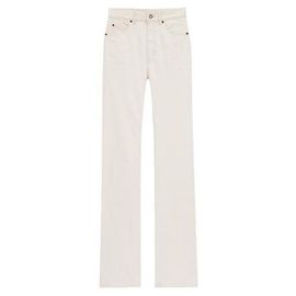 Saint Laurent Jeans de denim com leite de amêndoa Marrom