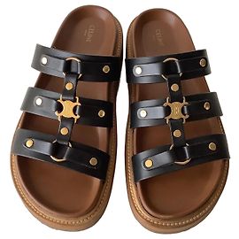 Mules Céline TIPPI en cuir de veau noir Triomphe doré Noir