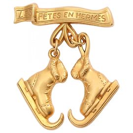 Broche plaquée or Hermès LE FETES EN Doré