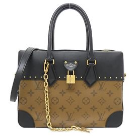 Bolsa City Malle Monogram Reverse Louis Vuitton Marrom