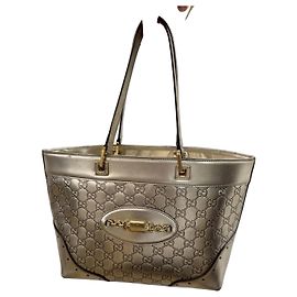 Bolsa Gucci em couro laminado dourado Dourado