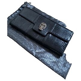 Philipp Plein Clutch de couro com caveira de cristais Preto