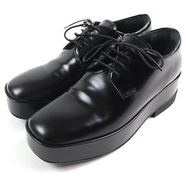 Scarpe da cerimonia in pelle con lacci e piattaforma con logo posteriore Prada Nero