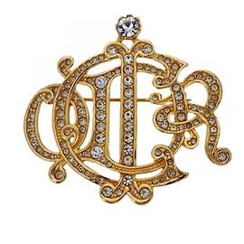 Goldplattierte Strassbrosche Christian Dior Golden