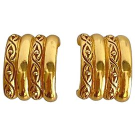 Boucles d'oreilles clip Yves Saint Laurent dorées Doré