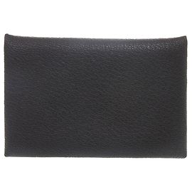 Hermes Excellent condition Hermès Calvi Chevre black card case with silver hardware and a double stamp (). Black case, model . Black