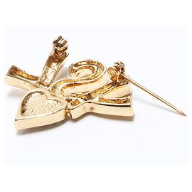Spilla a forma di cuore con logo dorato Yves Saint Laurent D'oro
