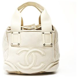 Sac à main en suède mouton ivoire avec marque Coco CHANEL Beige