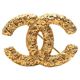 Broche Vintage Lava Coco Mark de Chanel Dorado