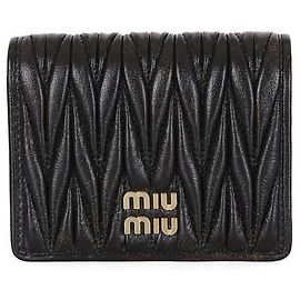 Miu Miu Pequeña cartera con efecto vintage Negro