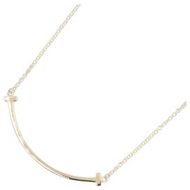 Collier T Smile Small en or jaune 18K de Tiffany & Co. Doré