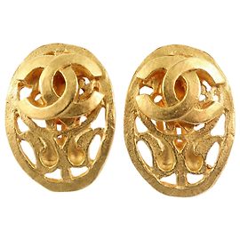 Boucles d'oreilles ovales clip-on en plaqué or CC doré de Chanel Doré