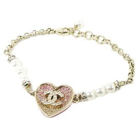 Bracciale charm Chanel in oro, rosa e bianco Rosa Bianco D'oro