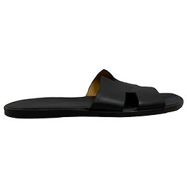 Sandálias de slide planas Hermès Izmir em couro de bezerro preto Preto