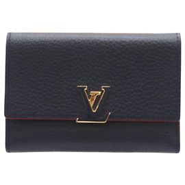 LOUIS VUITTON Portafoglio Capucines Compact Taurillon Marine Rouge in pelle blu navy e rossa per donne Rosso