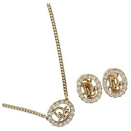 Set collana e orecchini Christian Dior, placcato oro con strass, circa ., Donna D'oro